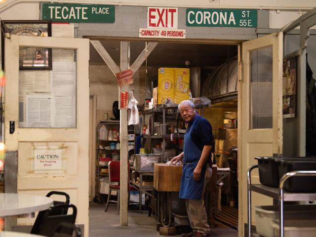 Man stands in the back of a historic restaurant
