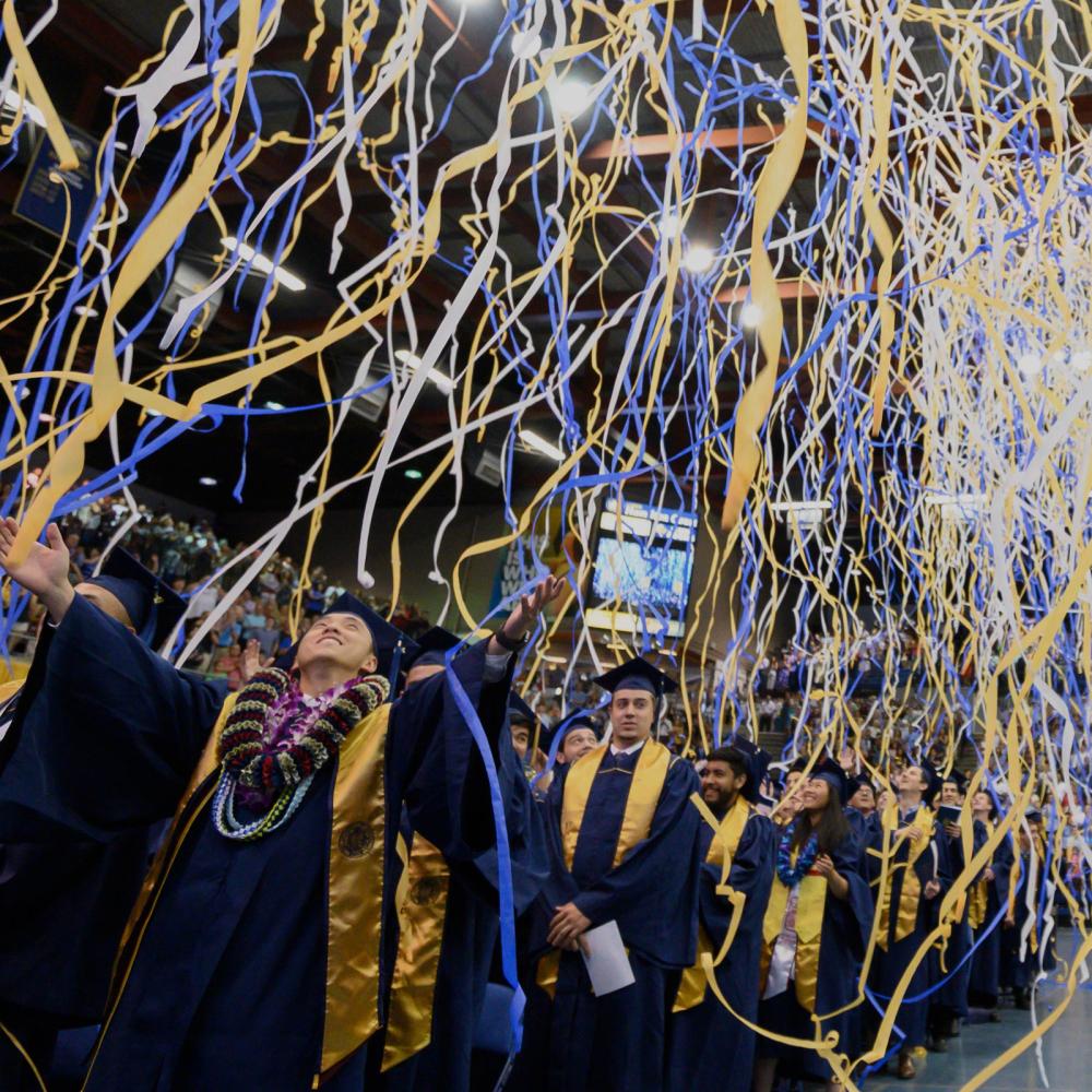 Streamers fall from the ceiling at the 春色视频 Commencement ceremony